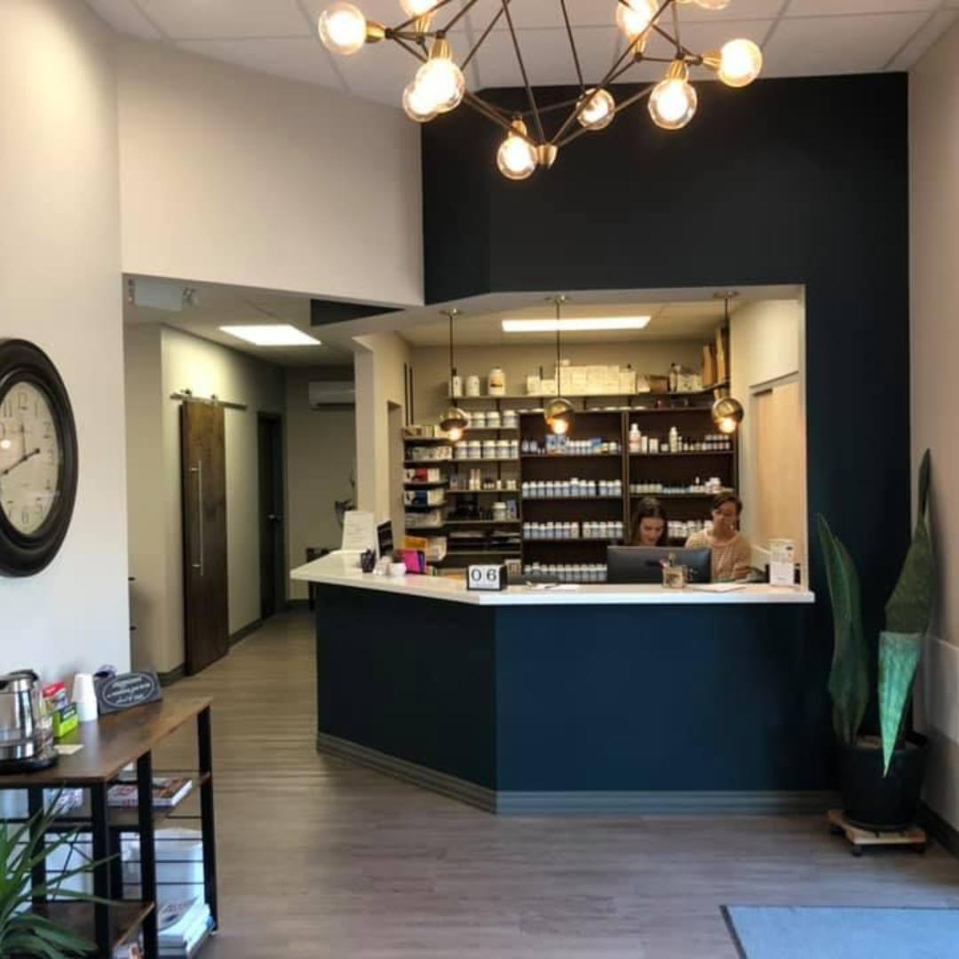 Painters Pro KC painted commercial service counter dark blue with cream side walls, featuring wood floors, a drink station, and employees at the counter.