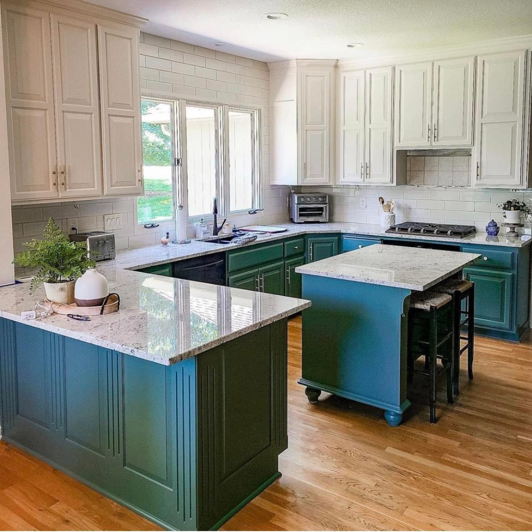 Kitchen cabinet refresh by Painters Pro KC, featuring upper cabinets painted cream and lower cabinets and island in vibrant dark turquoise, transforming and elevating the kitchen.